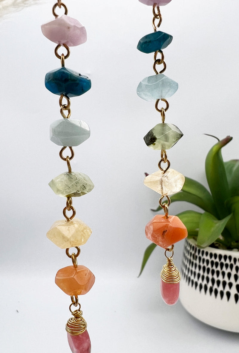 Gold chakra earrings with genuine kunzite, apatite, aquamarine, prehnite, citrine, carnelian, and watermelon quartz. 4” long, handcrafted for balance and energy.