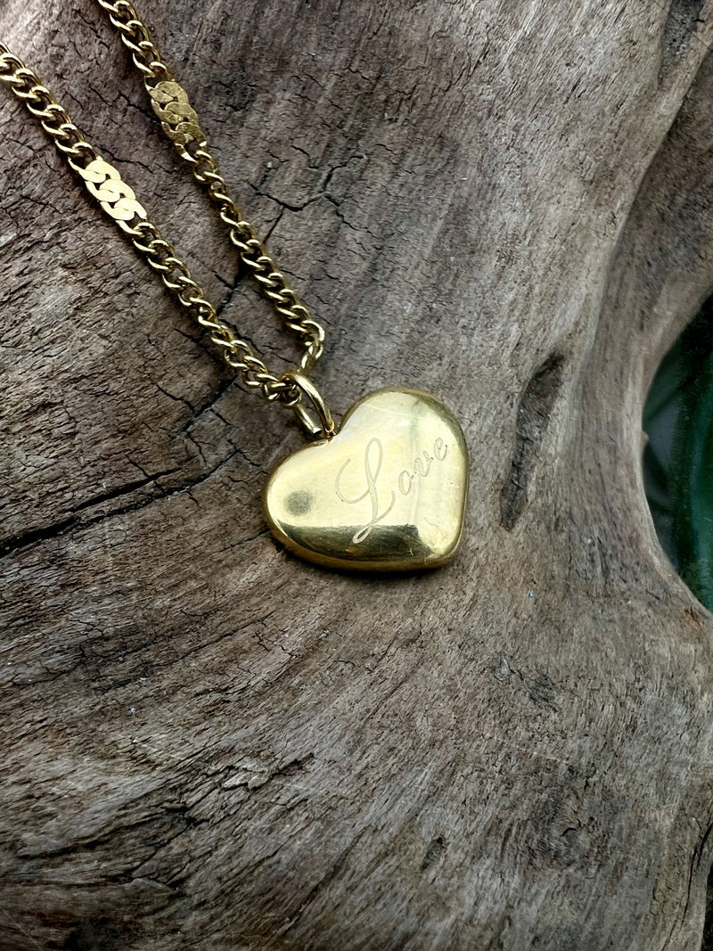 golden heart necklace with the word love on it. perfect for layering