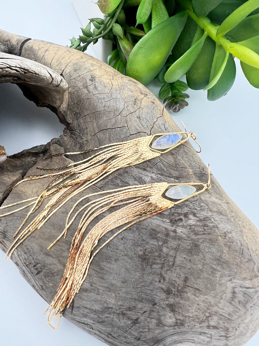 Long gemstone fringe earrings with gold or silver tassels, featuring moonstone, labradorite, lapis lazuli, hydro quartz, or rose quartz. Lightweight and shimmering.