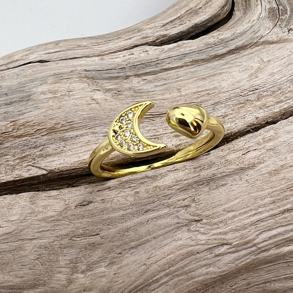Gold-plated stainless steel rings with CZ-studded moon designs. Adjustable, waterproof, and hypoallergenic.