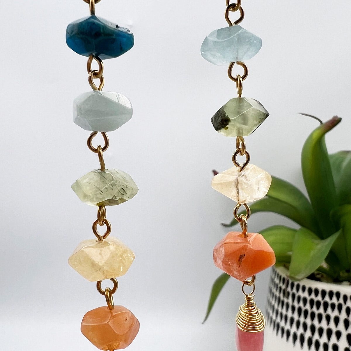 Gold chakra earrings with genuine kunzite, apatite, aquamarine, prehnite, citrine, carnelian, and watermelon quartz. 4” long, handcrafted for balance and energy.