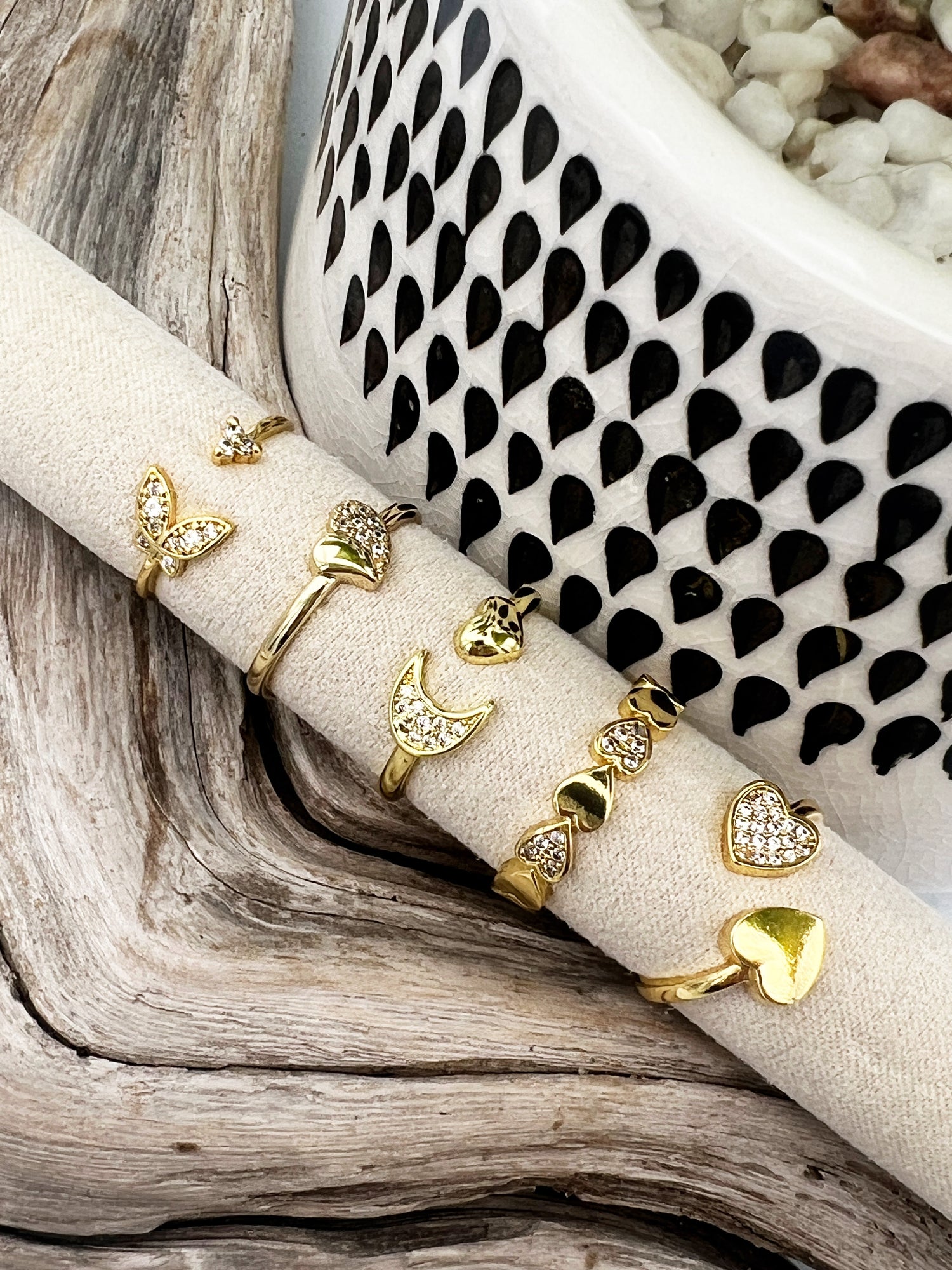 Gold-plated stainless steel rings with CZ-studded heart, butterfly, and moon designs. Adjustable, waterproof, and hypoallergenic.