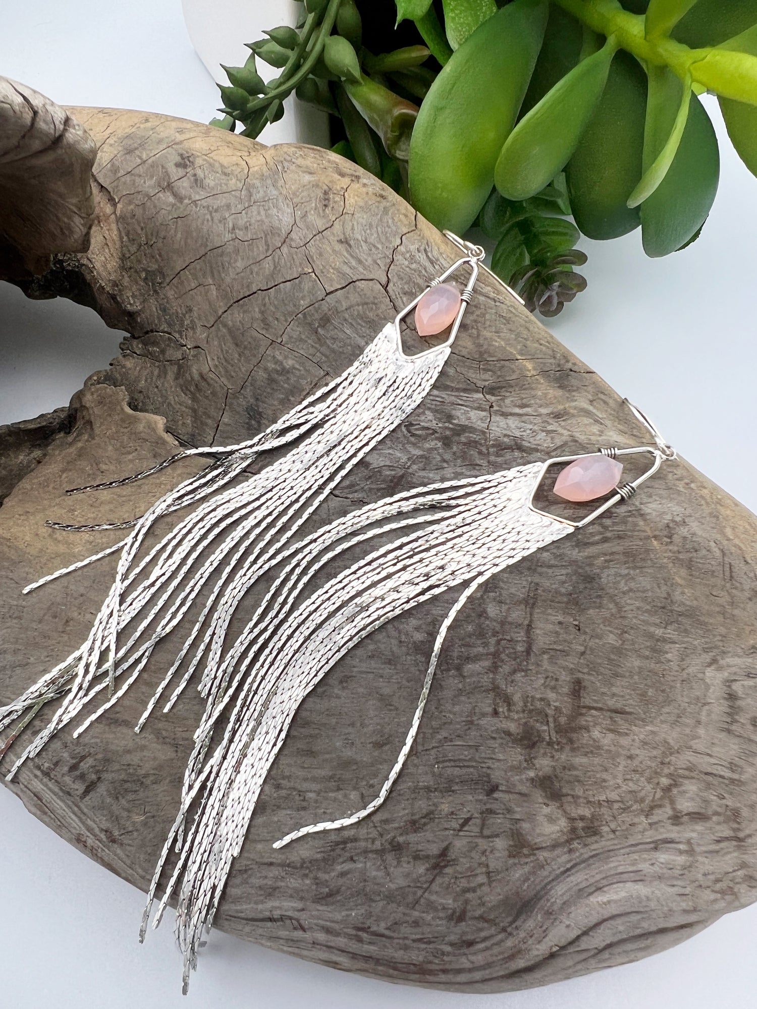 Long gemstone fringe earrings with gold or silver tassels, featuring pink opal. Lightweight and shimmering.