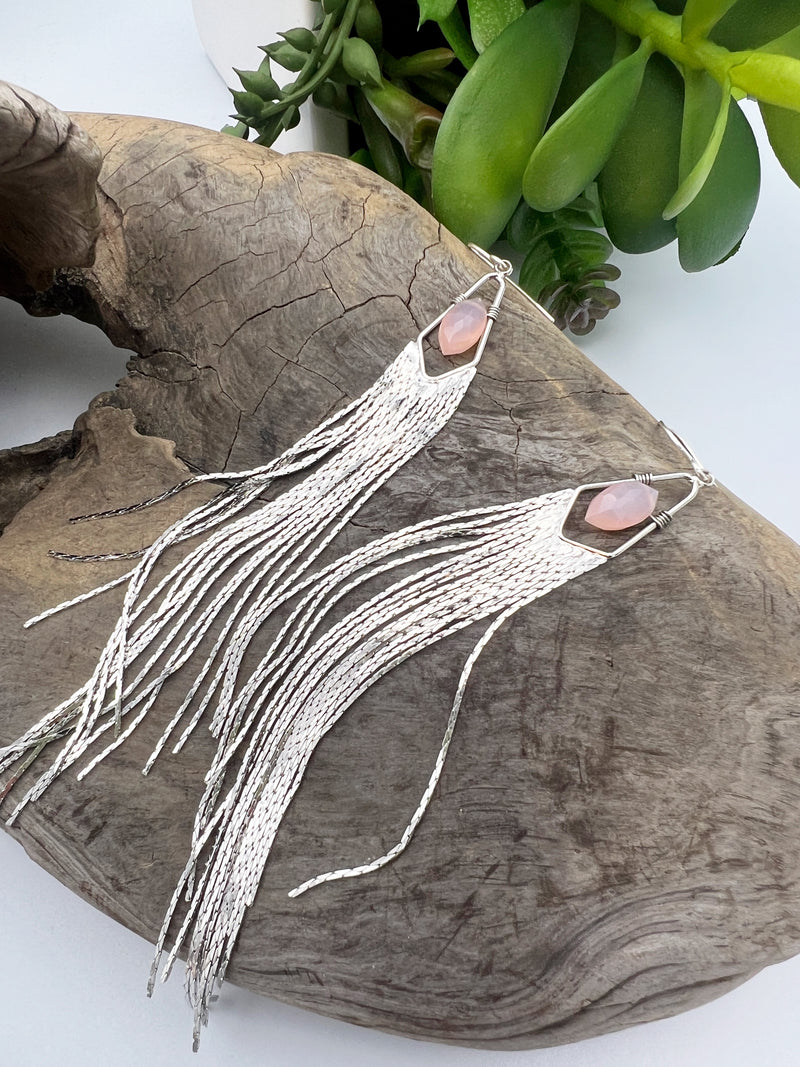 Long gemstone fringe earrings with gold or silver tassels, featuring pink opal. Lightweight and shimmering.