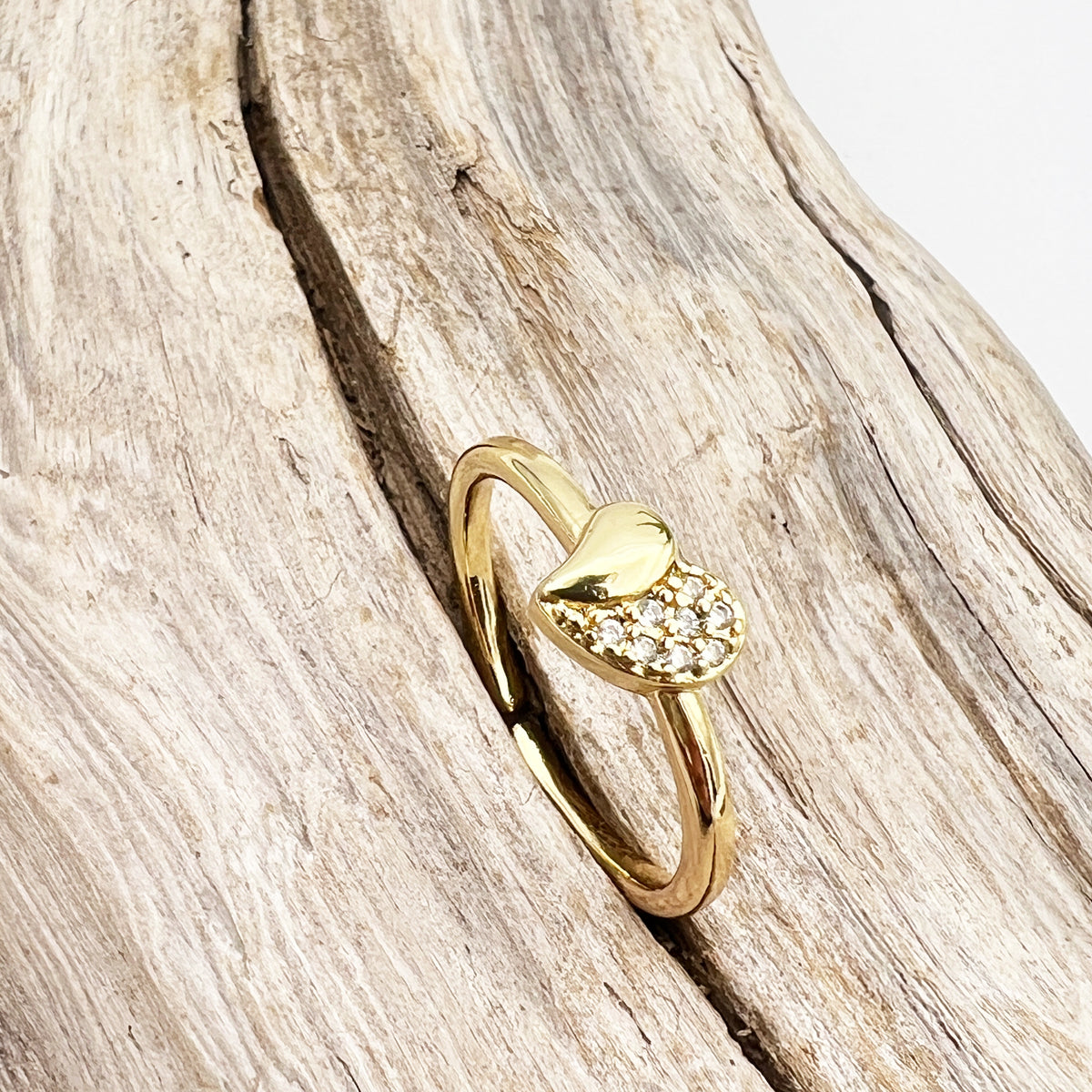 Gold-plated stainless steel rings with CZ-studded heart designs. Adjustable, waterproof, and hypoallergenic.