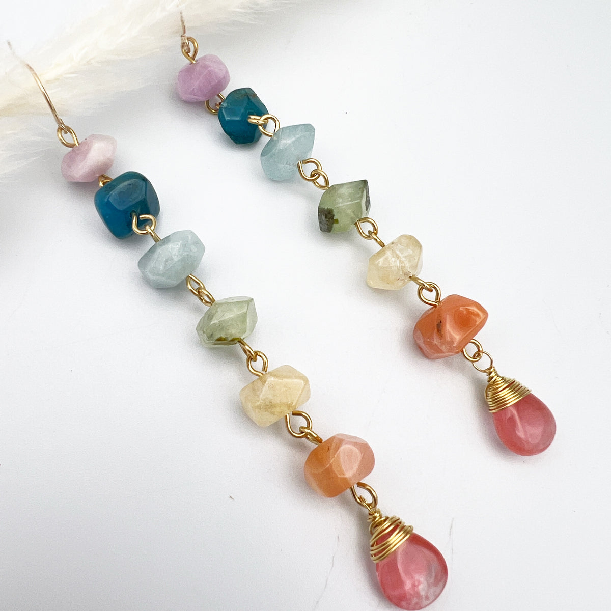 Gold chakra earrings with genuine kunzite, apatite, aquamarine, prehnite, citrine, carnelian, and watermelon quartz. 4” long, handcrafted for balance and energy.