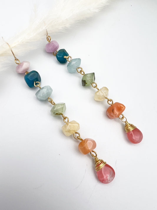 Gold chakra earrings with genuine kunzite, apatite, aquamarine, prehnite, citrine, carnelian, and watermelon quartz. 4” long, handcrafted for balance and energy.