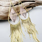 Fringe earrings with wired rose quartz and gold 
tassels. Statement design with 14k gold-filled ear wires, lightweight yet bold.