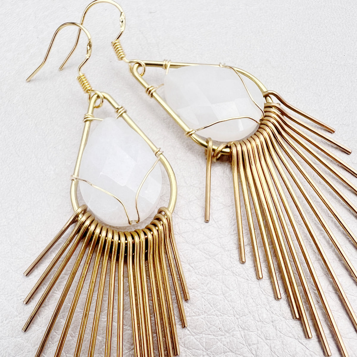 golden fringe earrings with white jade stone