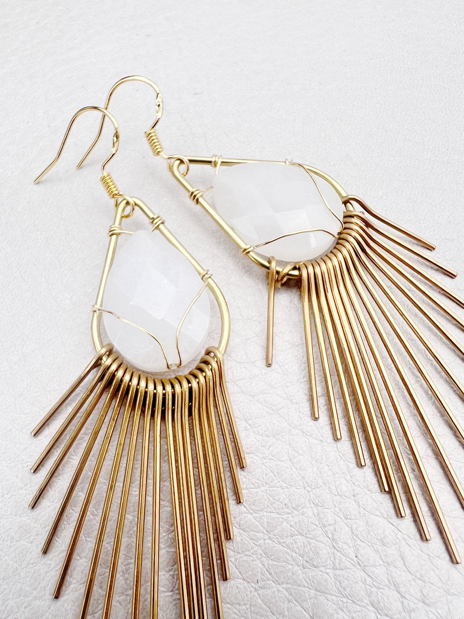 golden fringe earrings with white jade stone