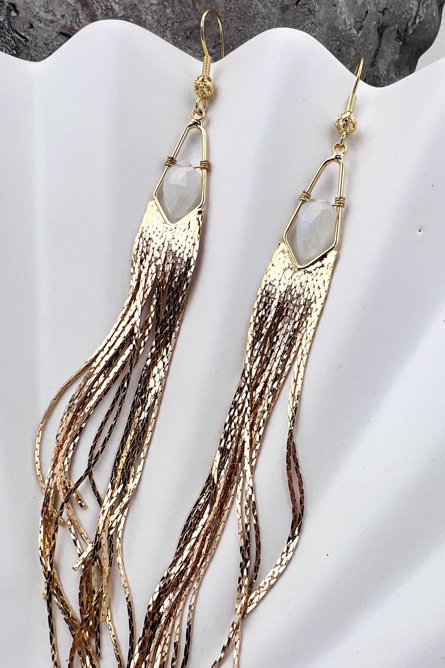 Long gemstone fringe earrings with gold or silver tassels, featuring moonstone. Lightweight and shimmering.