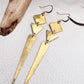 golden boho earrings with geometric shapes 