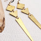 golden boho earrings with geometric shapes 