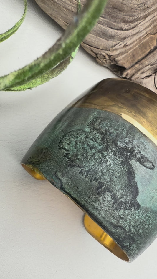 video of a wide patina bracelet with stunning turquoise and browns . 