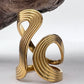 Gold abstract wave ring on a white background