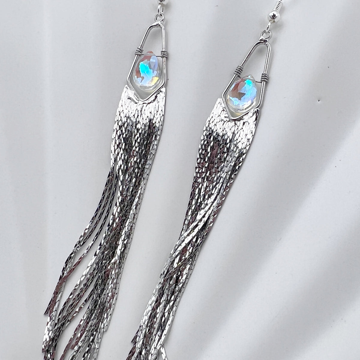 Long gemstone fringe earrings with silver tassels, featuring hydro quartz. Lightweight and shimmering.