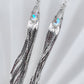 Long gemstone fringe earrings with silver tassels, featuring hydro quartz. Lightweight and shimmering.