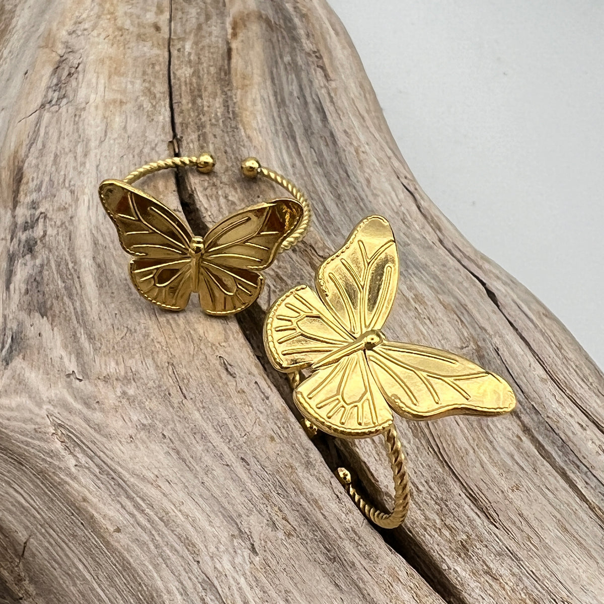 Dainty gold-plated stainless steel rings with butterfly. Adjustable, waterproof, and hypoallergenic.
