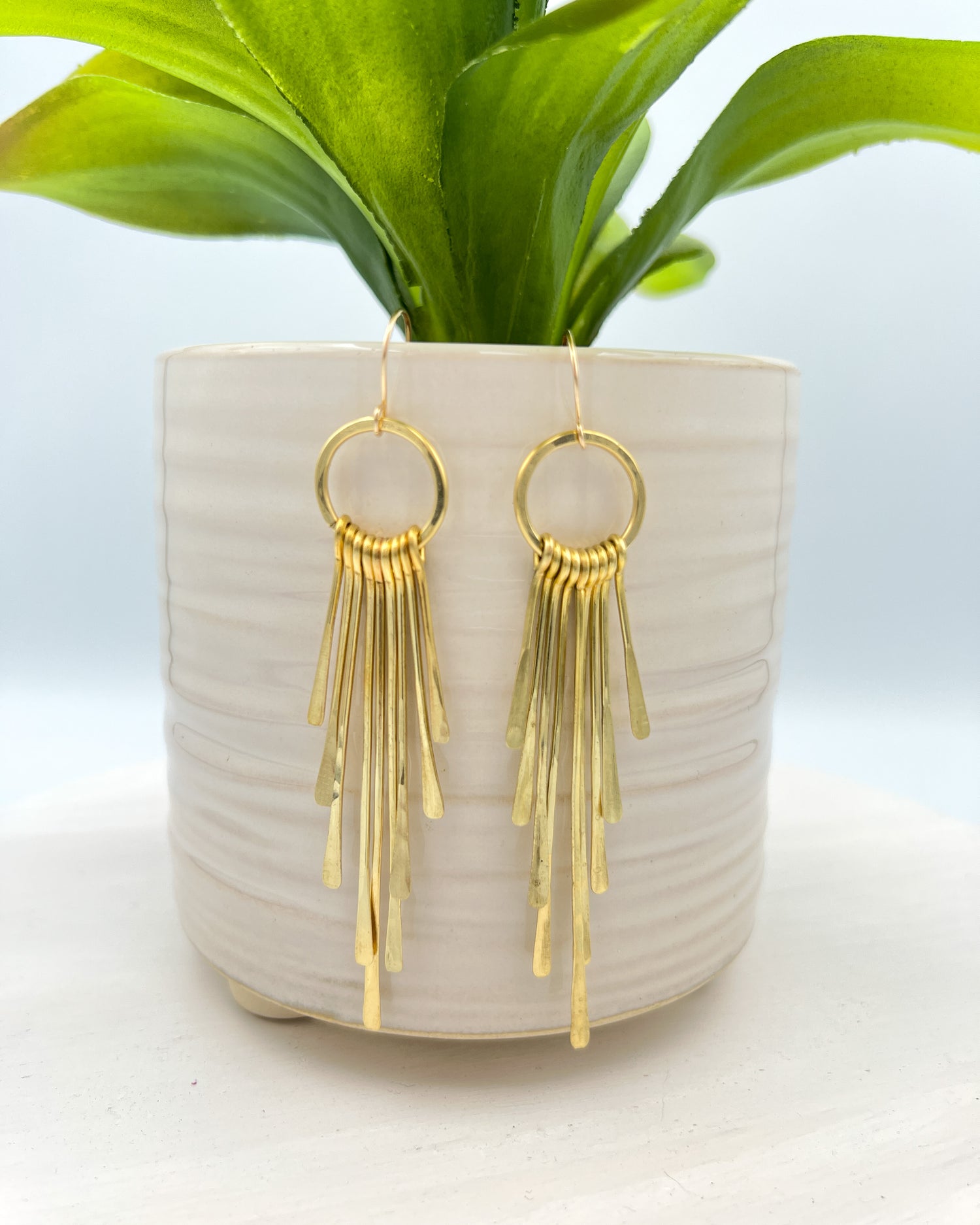hammered brass fringes on a hoop earrings by real to the roots