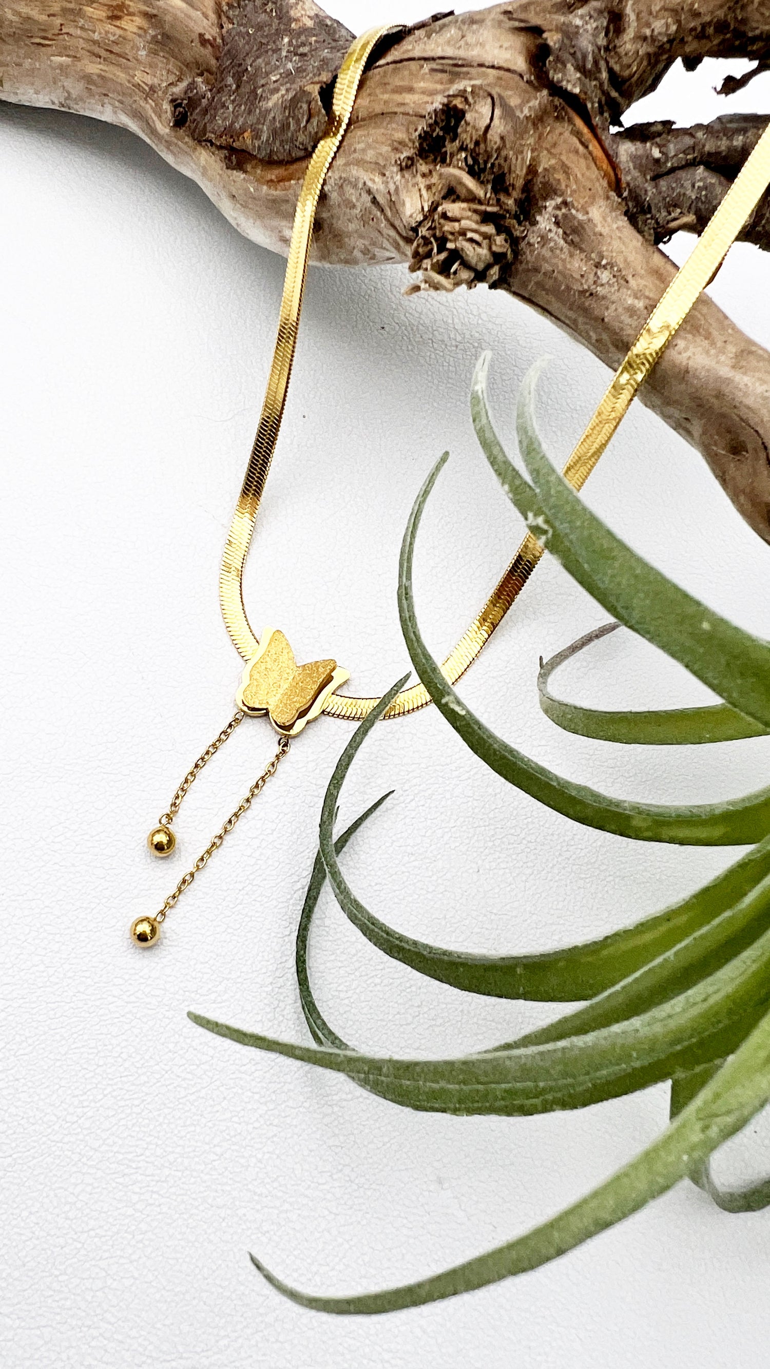 18k gold-plated stainless steel necklace with a butterfly charm, representing the thyroid and transformation. Adjustable 16” chain with 2” extender.
