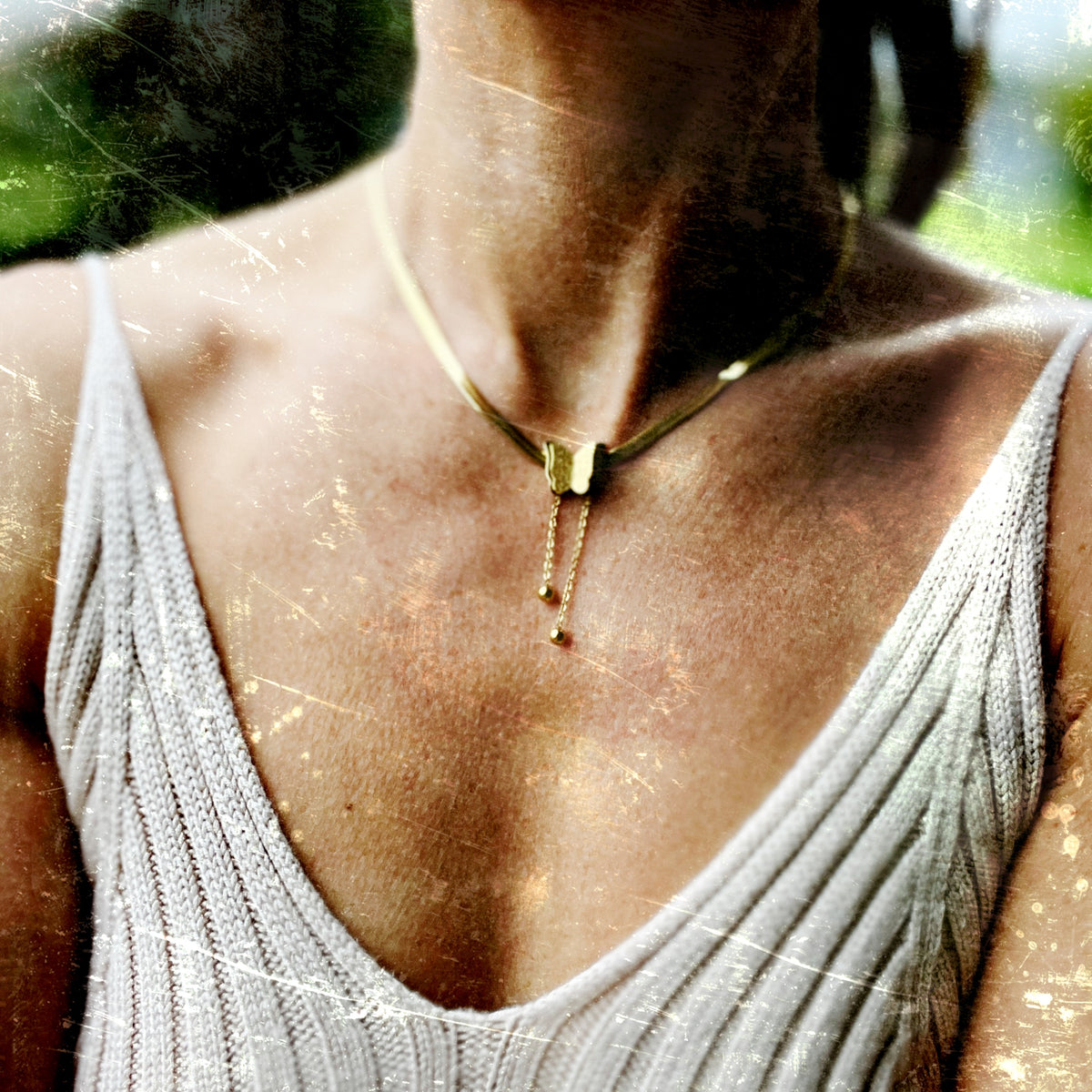18k gold-plated stainless steel necklace with a butterfly charm, representing the thyroid and transformation. Adjustable 16” chain with 2” extender.