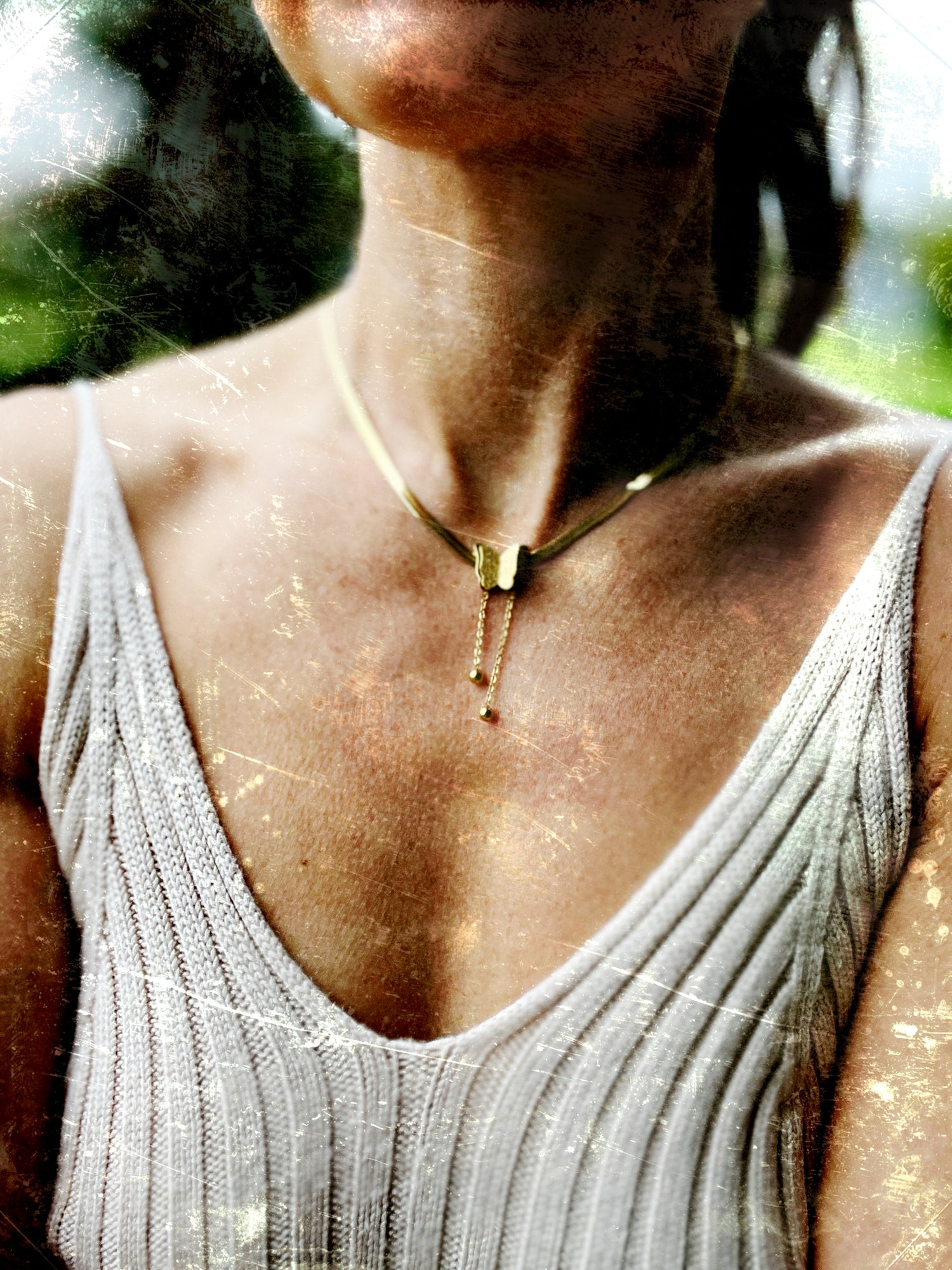 18k gold-plated stainless steel necklace with a butterfly charm, representing the thyroid and transformation. Adjustable 16” chain with 2” extender.
