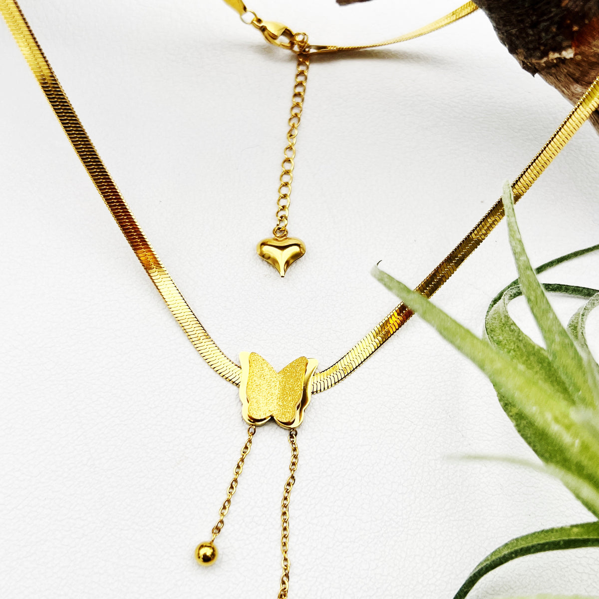 18k gold-plated stainless steel necklace with a butterfly charm, representing the thyroid and transformation. Adjustable 16” chain with 2” extender.